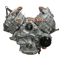 V8 engine with visible components and orange accents, showcasing intricate mechanical design for automotive purposes.